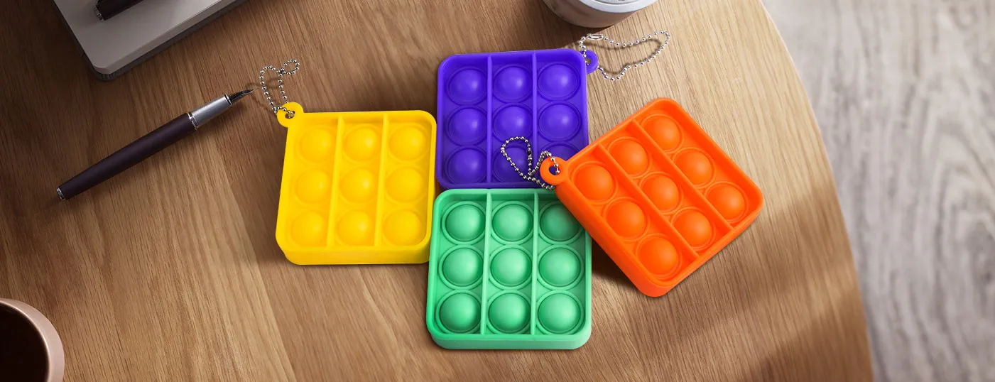 Display of Mini Push Pop Bubble Keychain