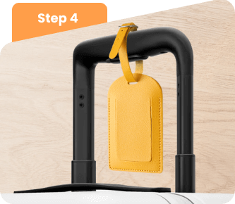 Fasten the strap to your suitcase handle. Fasten the strap to your suitcase handle.