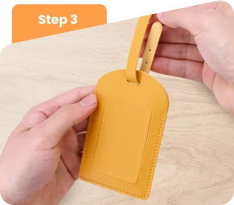 Loop the strap through the luggage tag and secure it.