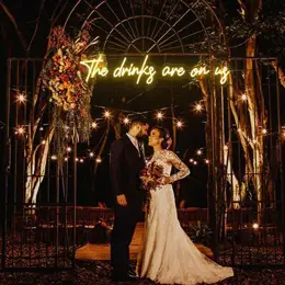 The drinks are on us neon sign