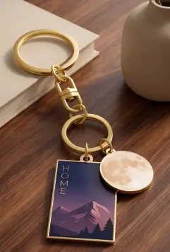 Gold printed keychain with mountain and moon