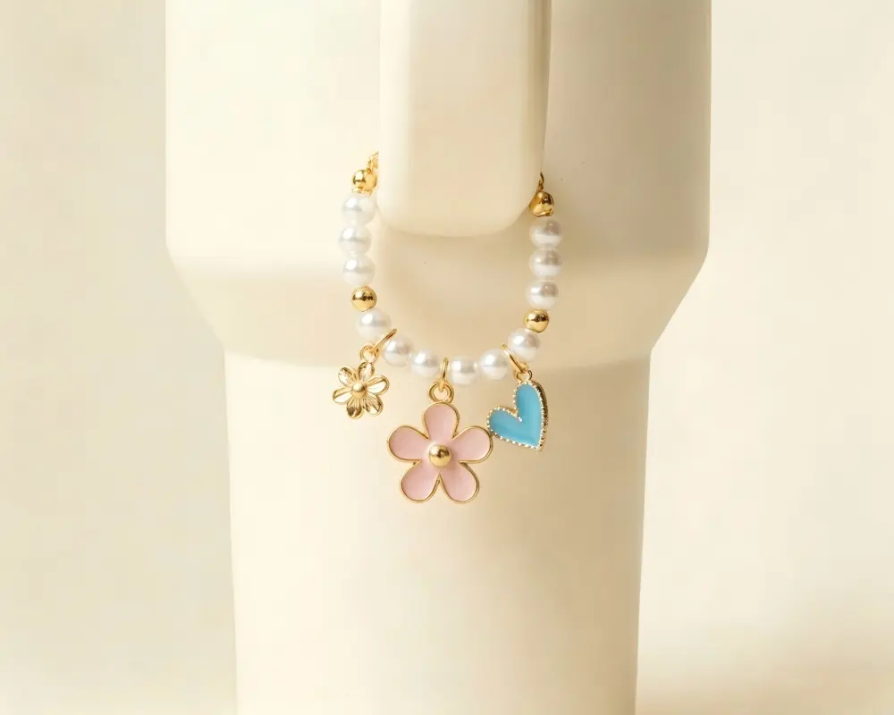 Metal VIP PassesFlower enamel charm attached to a tumbler handle pearl chain