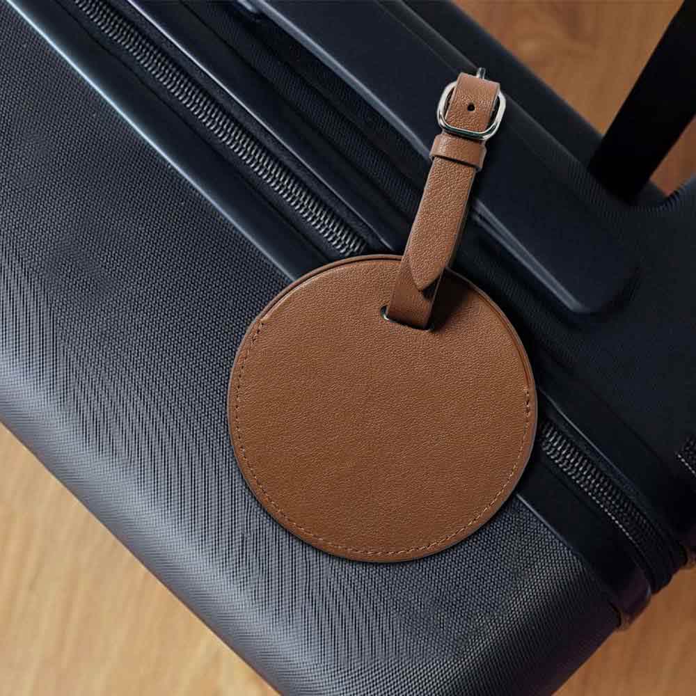Lifestyle shot of Customized Top Grain Cowhide Small Round Luggage Tag