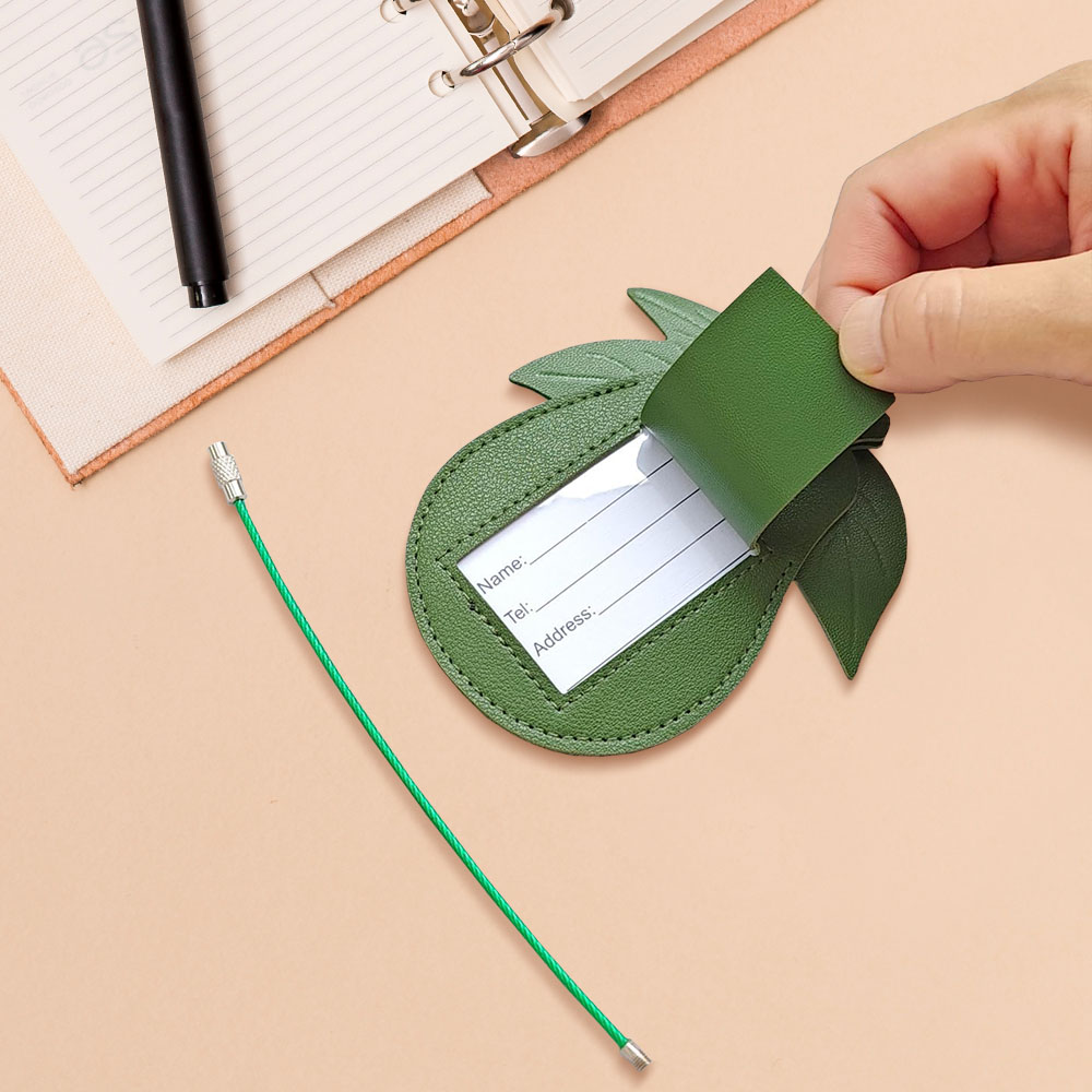 Lifestyle shot of Creative Avocado Top Layer Leather Luggage Tag