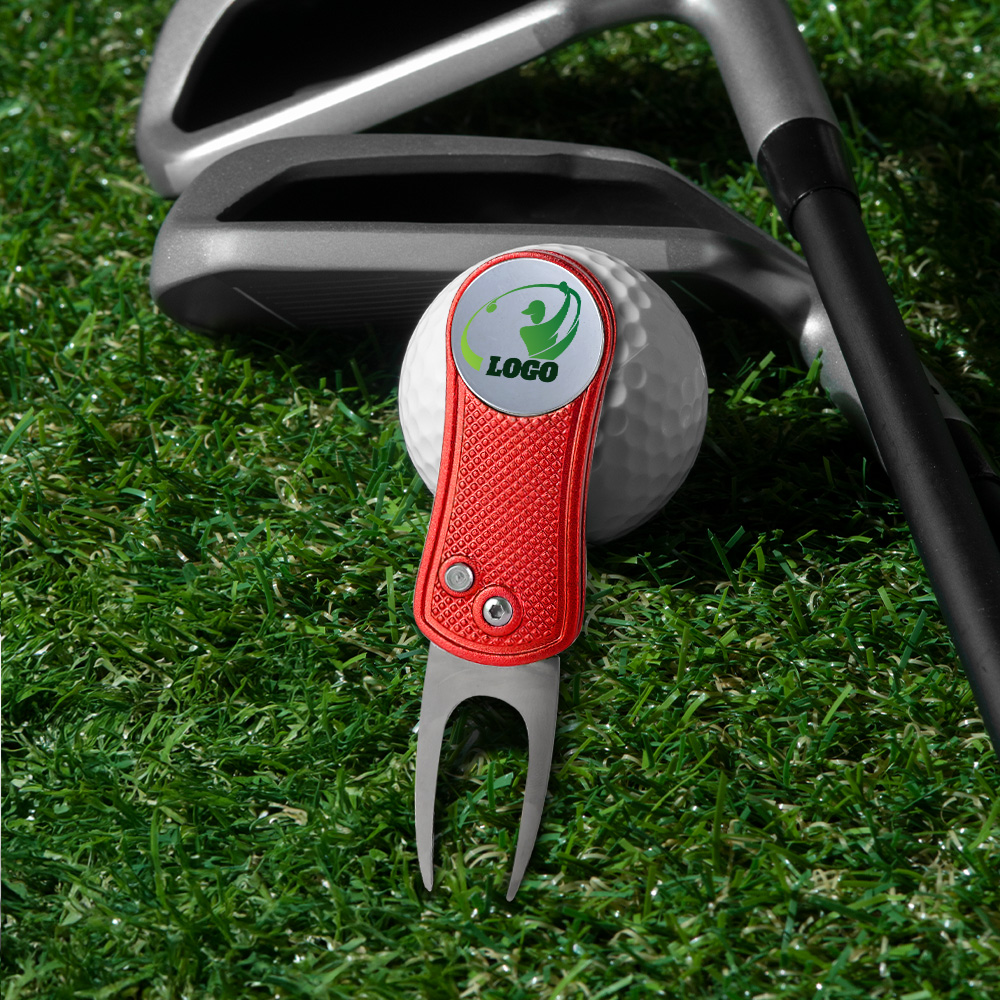 Lifestyle shot of Magnetic Folding Golf Divot Tool with Ball Marker Lifestyle shot of Magnetic Folding Golf Divot Tool with Ball Marker