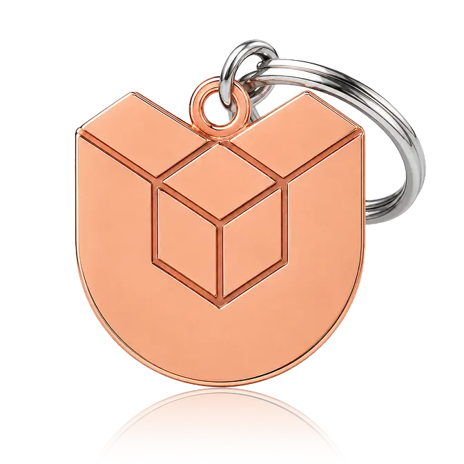 die struck geometry keychain with shiney copper